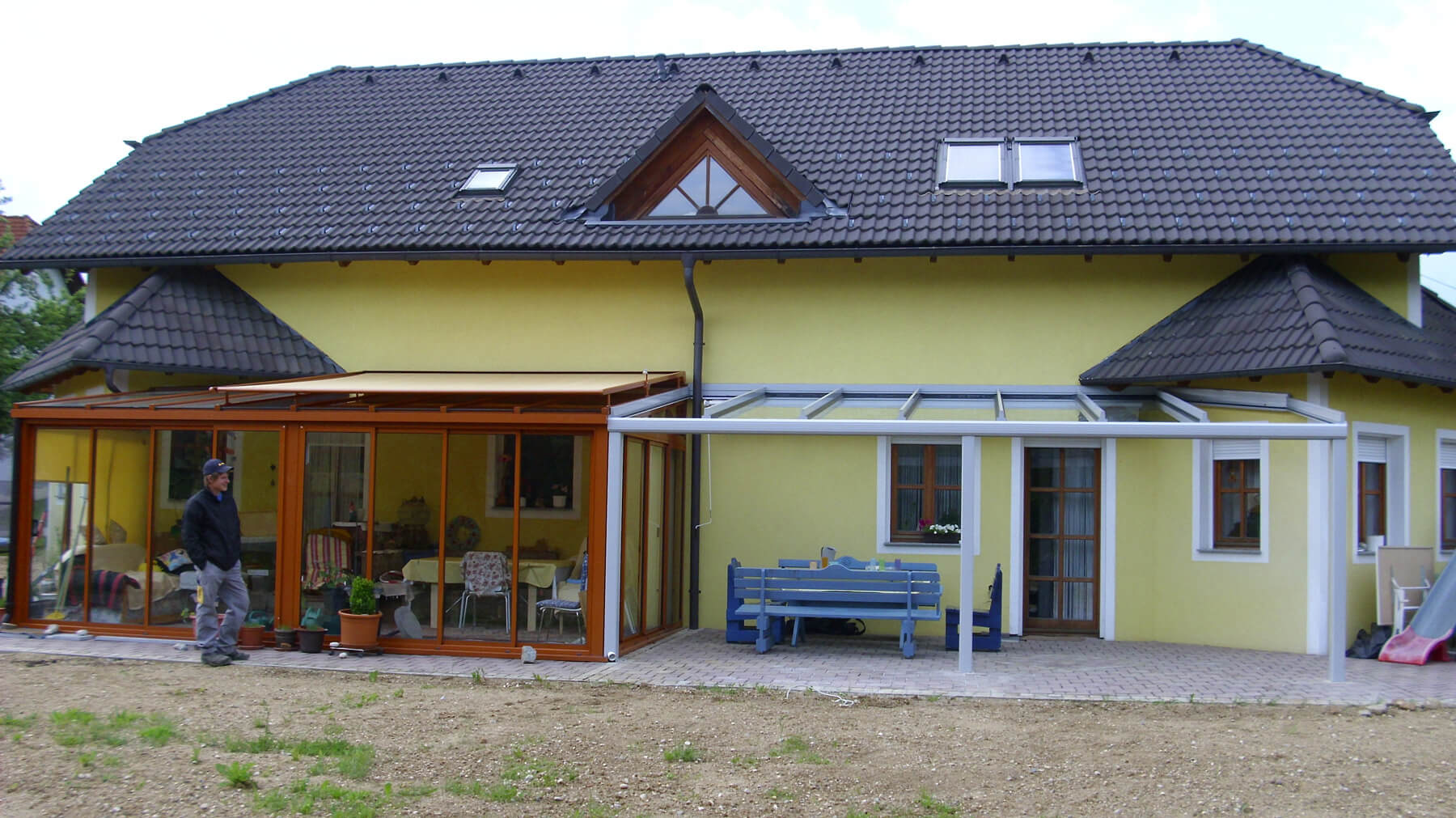 Verlängerung des Wintergartendaches mit einer Terrassenüberdachung